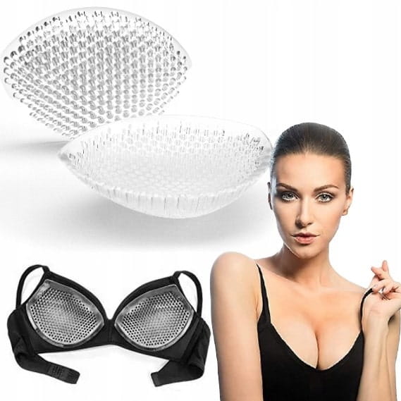 Para transparentnych silikonowych wkładek push-up do biustonosza ułożona obok siebie na jasnym tle